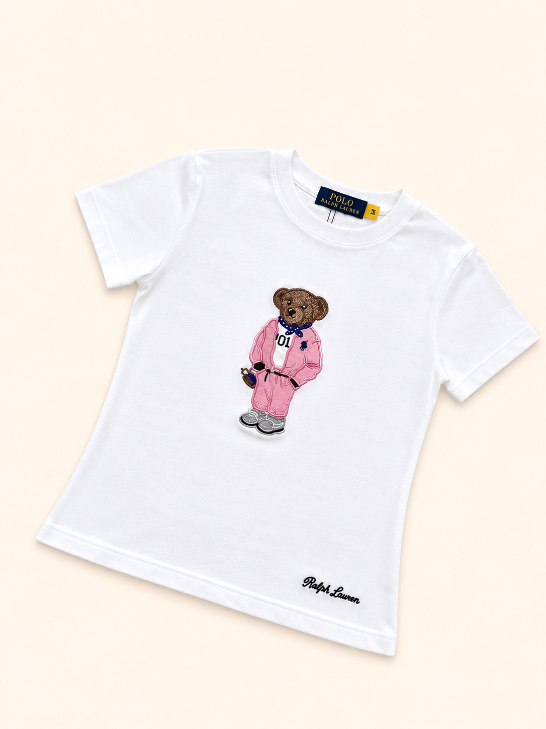 CAMISA POLO BLANCA OSO ROSADO
