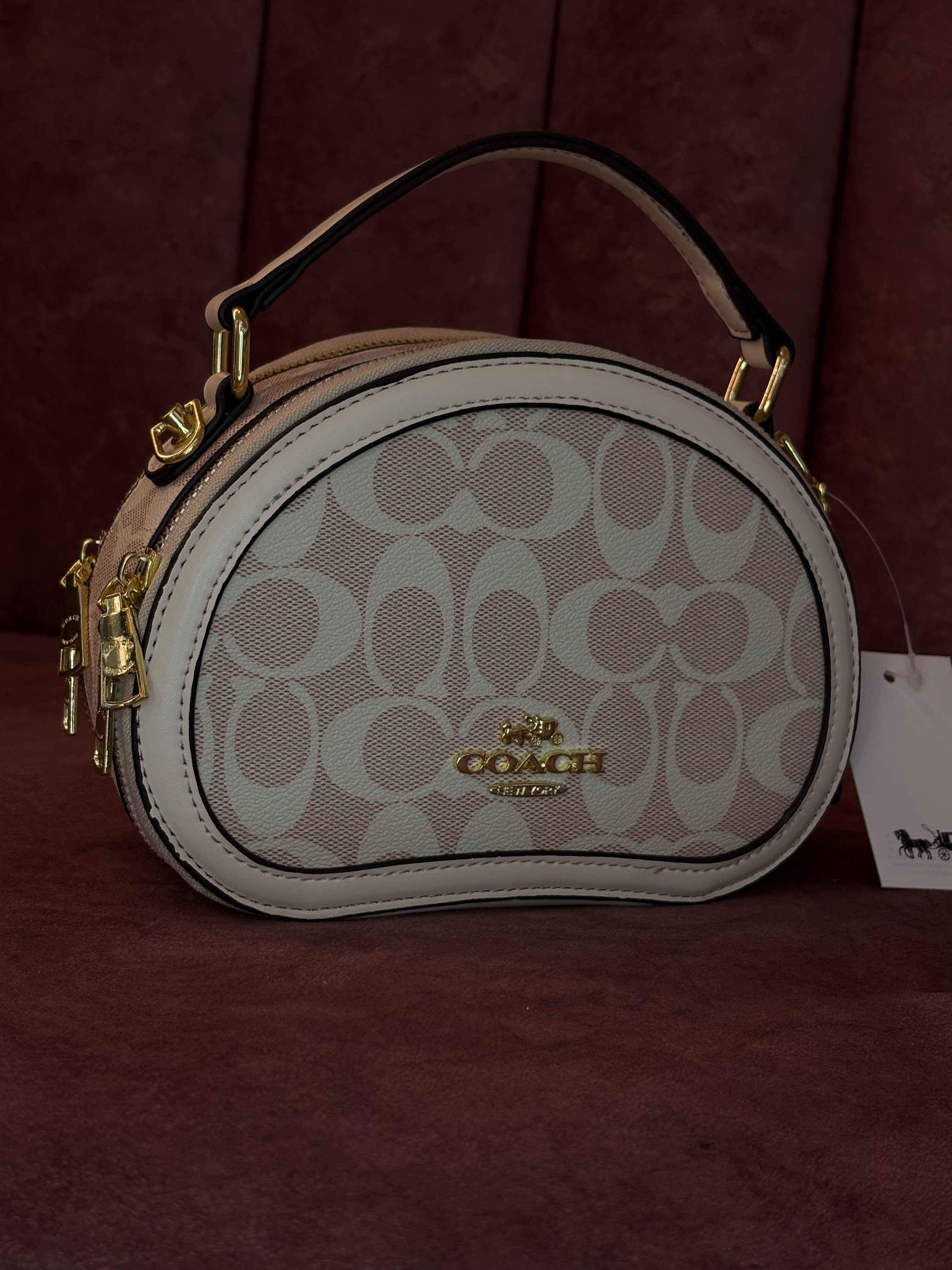 BOLSO DE MANO COACH ROSADO
